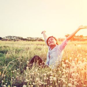 beautiful young hipster woman sitting on the meadows stretch like she so fresh