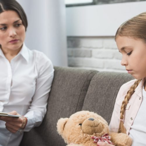 professional-young-psychologist-trying-get-through-girl-with-problems professional-young-psychologist-trying-get-through-girl-with-problems